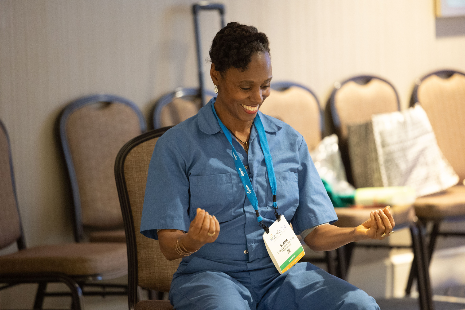 Member at convention - 1500 x 1000 Woman smiles