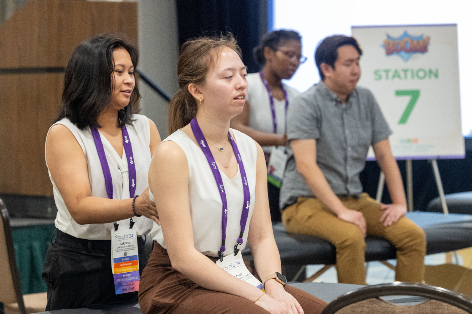 OMT 12 - 1500 x 1000 Woman demonstrates osteopathic manipulative therapy on person