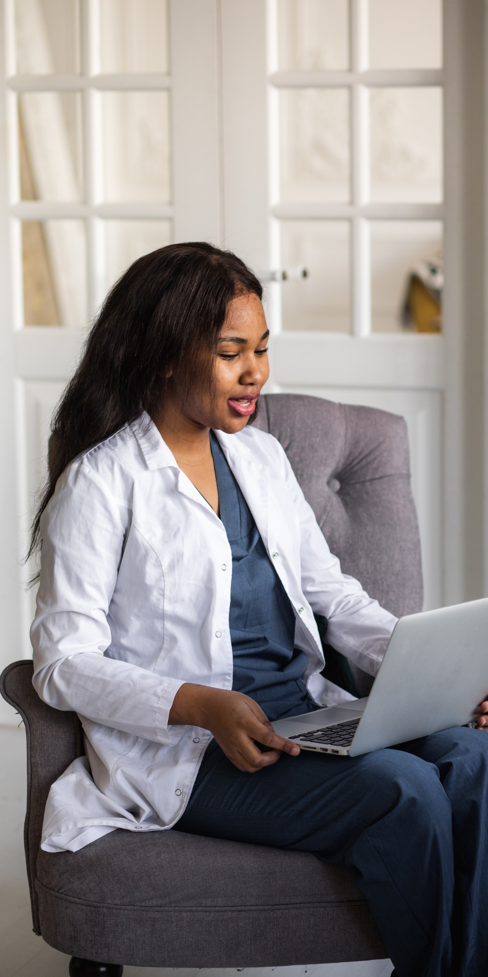 Doctor working on laptop - 1000 x 2000 Resident working on laptop